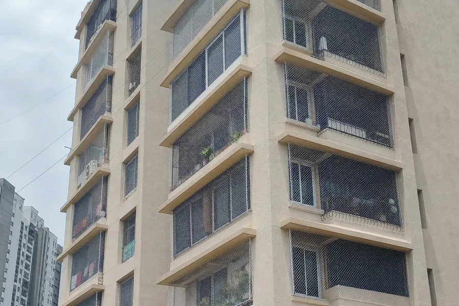 Window safety nets installed on a residential apartment in Navi Mumbai